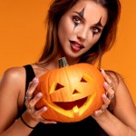 Halloween Sexy Girl wearing costume and joker's makeup.