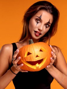 Halloween Sexy Girl wearing costume and joker's makeup.