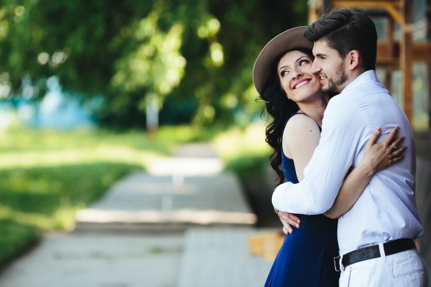 romantic-couple-embracing-outdoors_1153-876